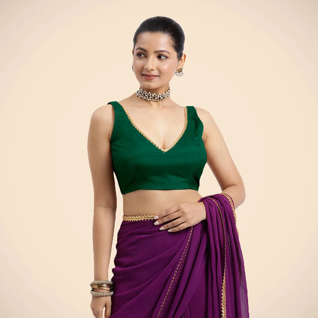 Raisa x Tyohaar | Bottle Green Sleeveless FlexiFit™ Saree Blouse with V Neckline with Golden Gota Lace Embellishment and Back Cut-out with Tie-Up