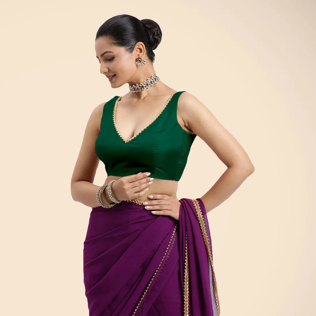 Raisa x Tyohaar | Bottle Green Sleeveless FlexiFit™ Saree Blouse with V Neckline with Golden Gota Lace Embellishment and Back Cut-out with Tie-Up